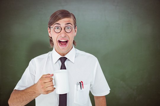 Composite image of geeky businessman holding a mug 