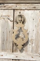 Old knocker on a wood door, Morocco style