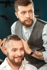 Fototapeta premium Hair styling by a professional barber