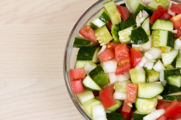 Vegetable salad with onion, tomato and cucumber