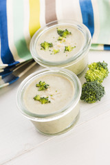 Broccoli cream soup on table