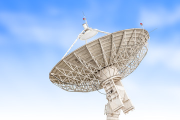 satellite dish antenna radar big size isolated on blue sky backg