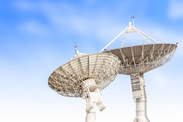satellite dish antenna radar big size isolated on blue sky backg