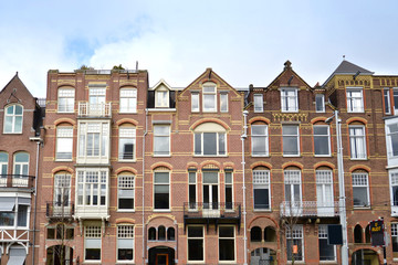 Fototapeta na wymiar Front view of traditional buildings in Amsterdam, Netherlands