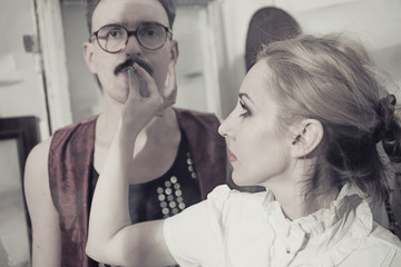 husband and wife behind the glass