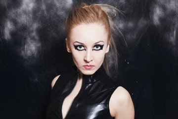 Portrait of beautiful young woman with bright gothic makeup
