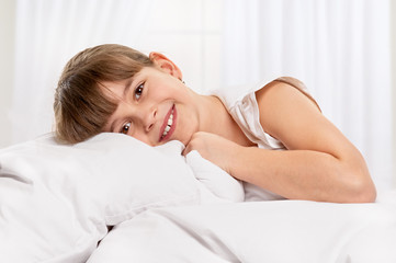 Fototapeta premium Little girl in the bed