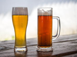 Beer mug and glass with light or dark drinks