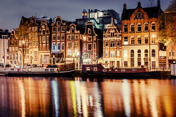 Obraz premium Beautiful night in Amsterdam. Night illumination of buildings an