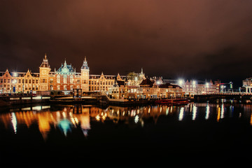 Obraz premium Beautiful night in Amsterdam. Night illumination of buildings an
