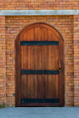 wood door with brick wall