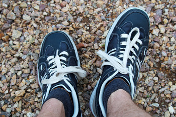 Man is relaxing in stylish blue shoes