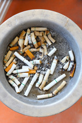 Cigarette butts discarded in ashtray