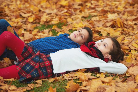 boy and girl in autumn park
