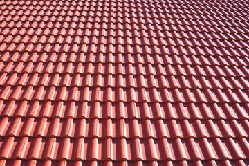 Red corrugated tile element of roof. Seamless pattern