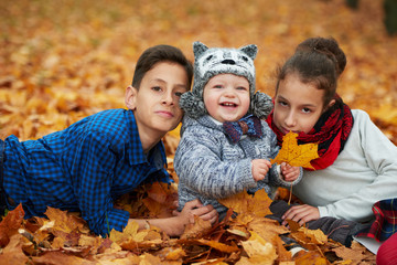 boys and girl in autumn park