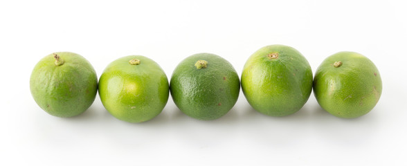 green lemon isolated on white background