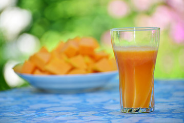 Glass of a tasty pumpkin juice and pumpkin,