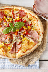 Pizza with ham, corn and pepper