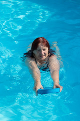 Senior active woman swimming