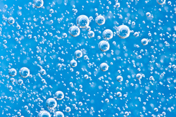 Macro Oxygen bubbles in blue clear water