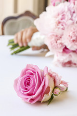 Wedding bouquet with pink peonies, carnations and roses