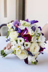 Wedding bouquet with roses, freesias, chrysanthemums and lavende