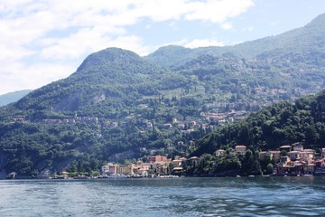 Fototapeta na wymiar Lake Como view towards Menaggio under blue sky in Lombardy Italy 