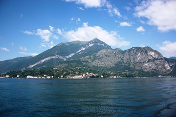 Lake Como view towards Menaggio under blue sky in Lombardy Italy 