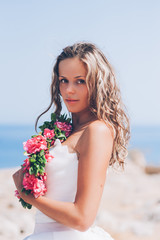 Fototapeta na wymiar Portrait of beautiful young woman wearing floral wreath