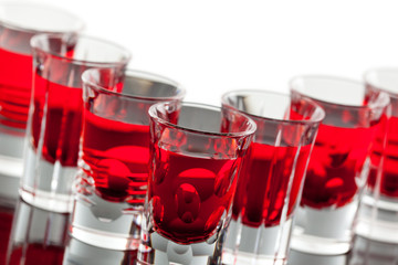 Rows of crystal shot glasses in an angle