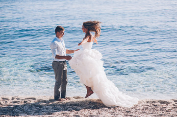 Bride and groom by the sea on their wedding day