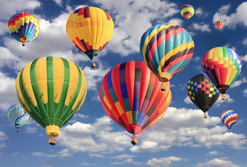 Multicolored hot air balloons flying