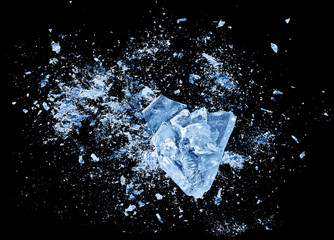 Abstract blue Ice crash explosion parts on black background. Collision, suspension crystal ice...