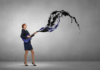 Businesswoman playing guitar