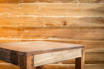 Empty top wooden table and wooden wall background