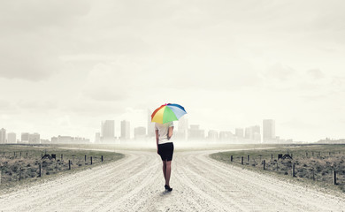 Woman with rainbow umbrella