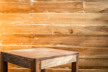 Empty top wooden table and wooden wall background