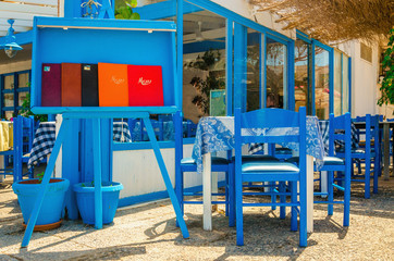 Fototapeta na wymiar Typical Greek restaurant - blue and white, Greece