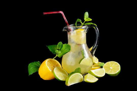 fresh lemonade with mint and lemon isolated on black background