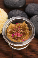 Homemade body peeling with sugar, olive oil and rose petal