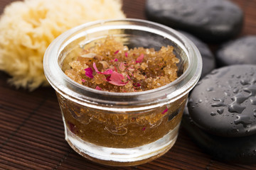 Homemade body peeling with sugar, olive oil and rose petal