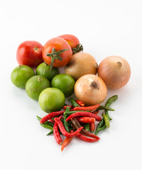 tomatoes, onions, green lemons on white