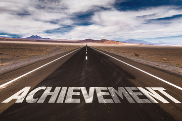 Achievement written on desert road