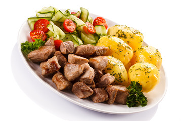 Grilled meat with boiled potatoes and vegetables 