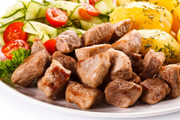 Grilled meat with boiled potatoes and vegetables 