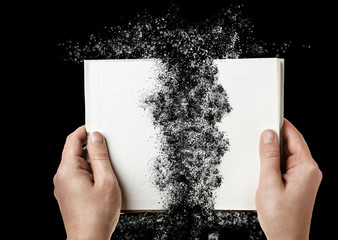 Torn book Isolated on black