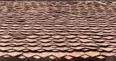 Old roof tiles on the roof of an old house 