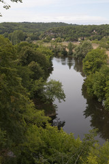 Fototapeta na wymiar La Vezere River. The La Vezere River meanders calmly through the French countryside.