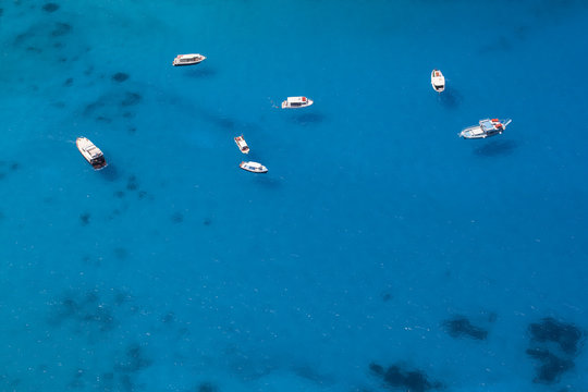 Boats Anchored in a Sea Bay with Turquoise Water